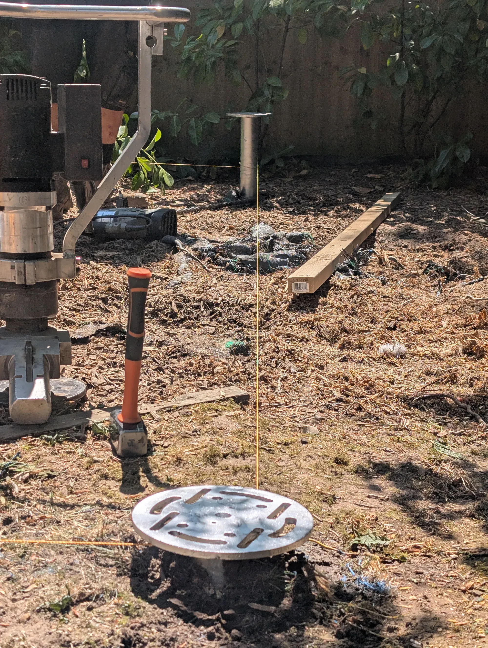 Professional ground screw machinery installing a galvanised screw