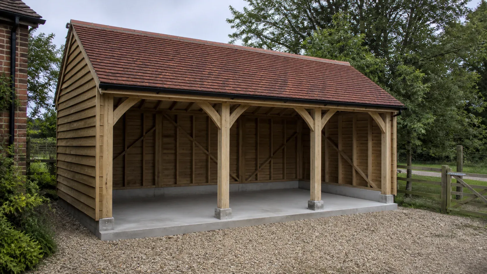 Open-fronted oak cart shed on a level hardstanding