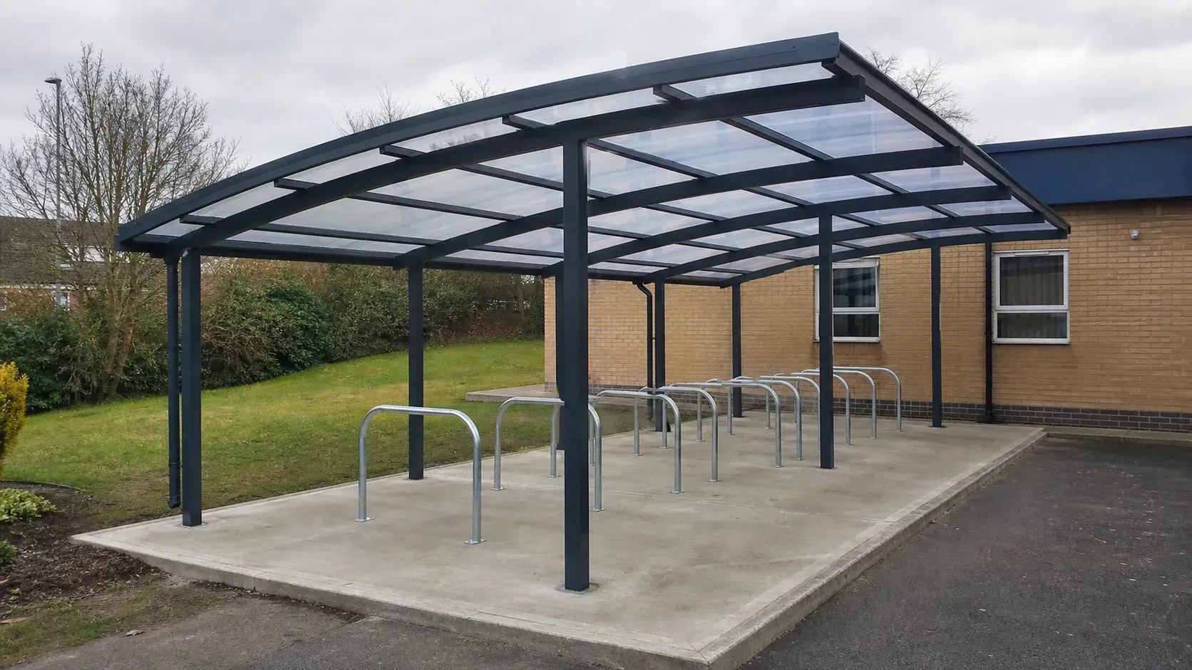 Secure glazed cycle hub fixed to a level concrete foundation