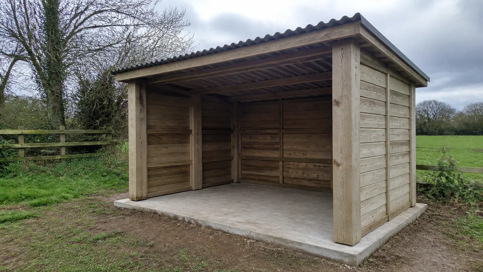 Open-fronted timber field shelter on a firm drained base