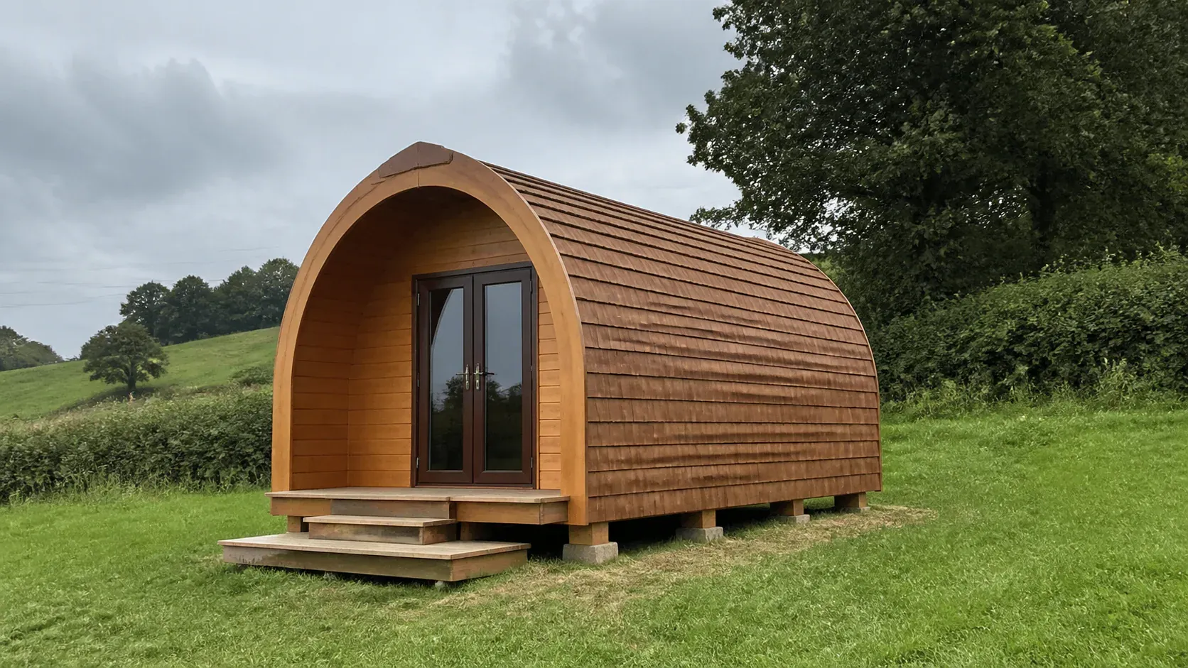 Timber glamping pod on a level raised foundation in a rural setting