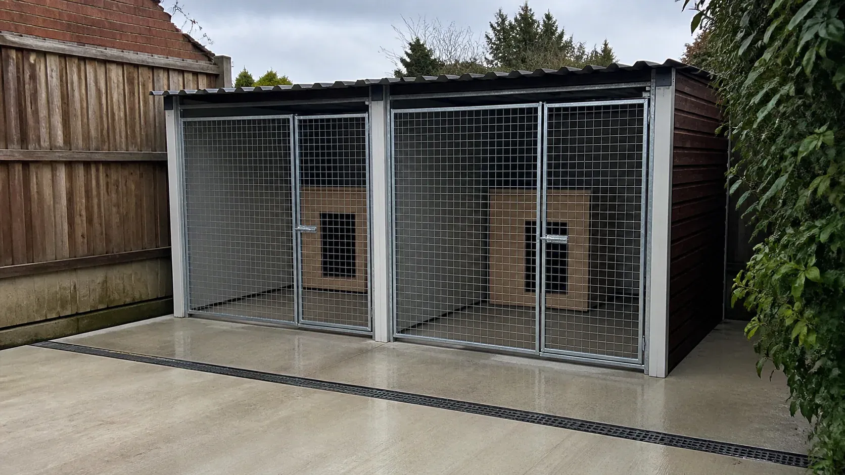 Secure outdoor dog kennel building on a clean concrete base
