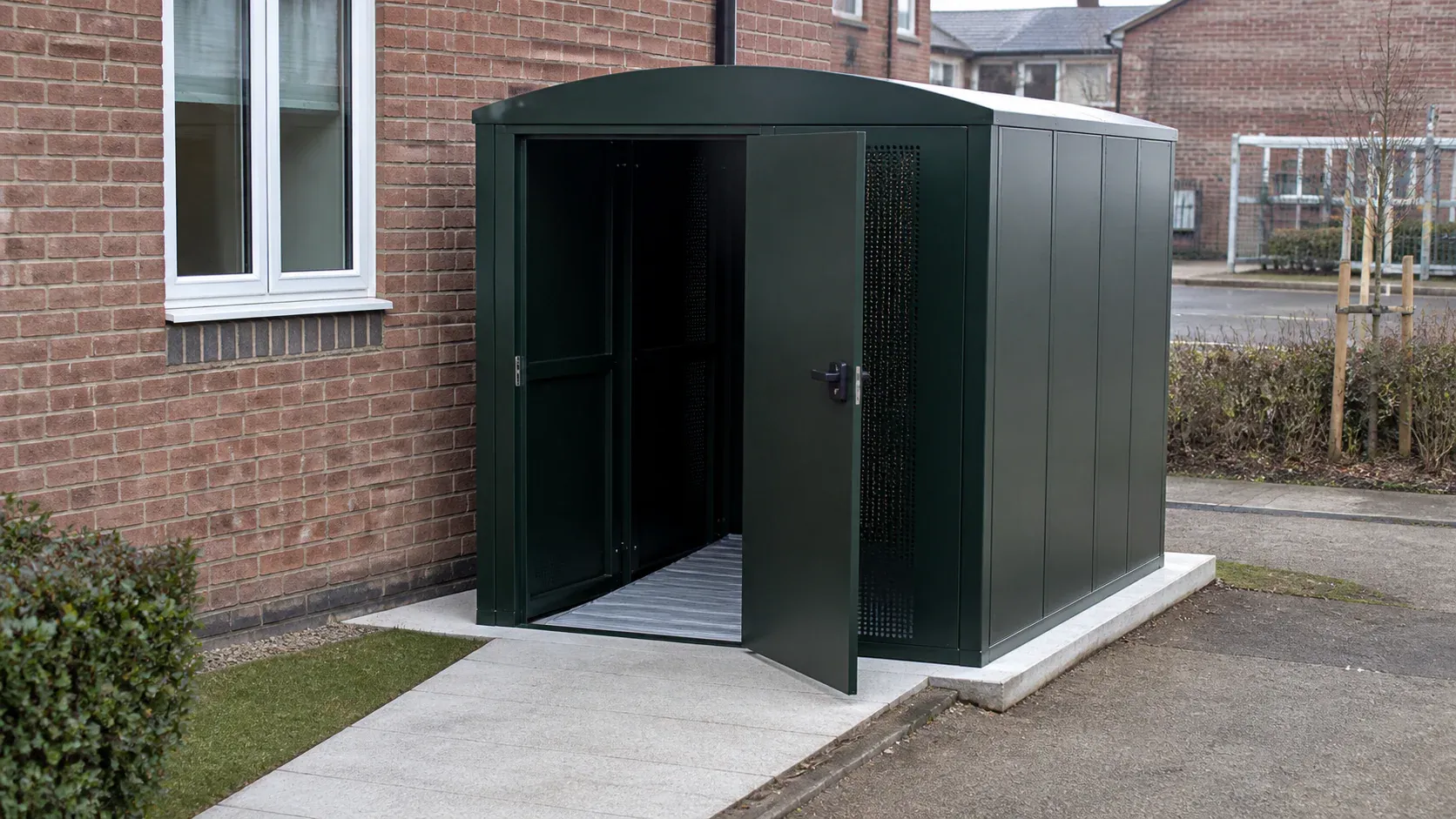 Secure mobility scooter storage shed on a level accessible base