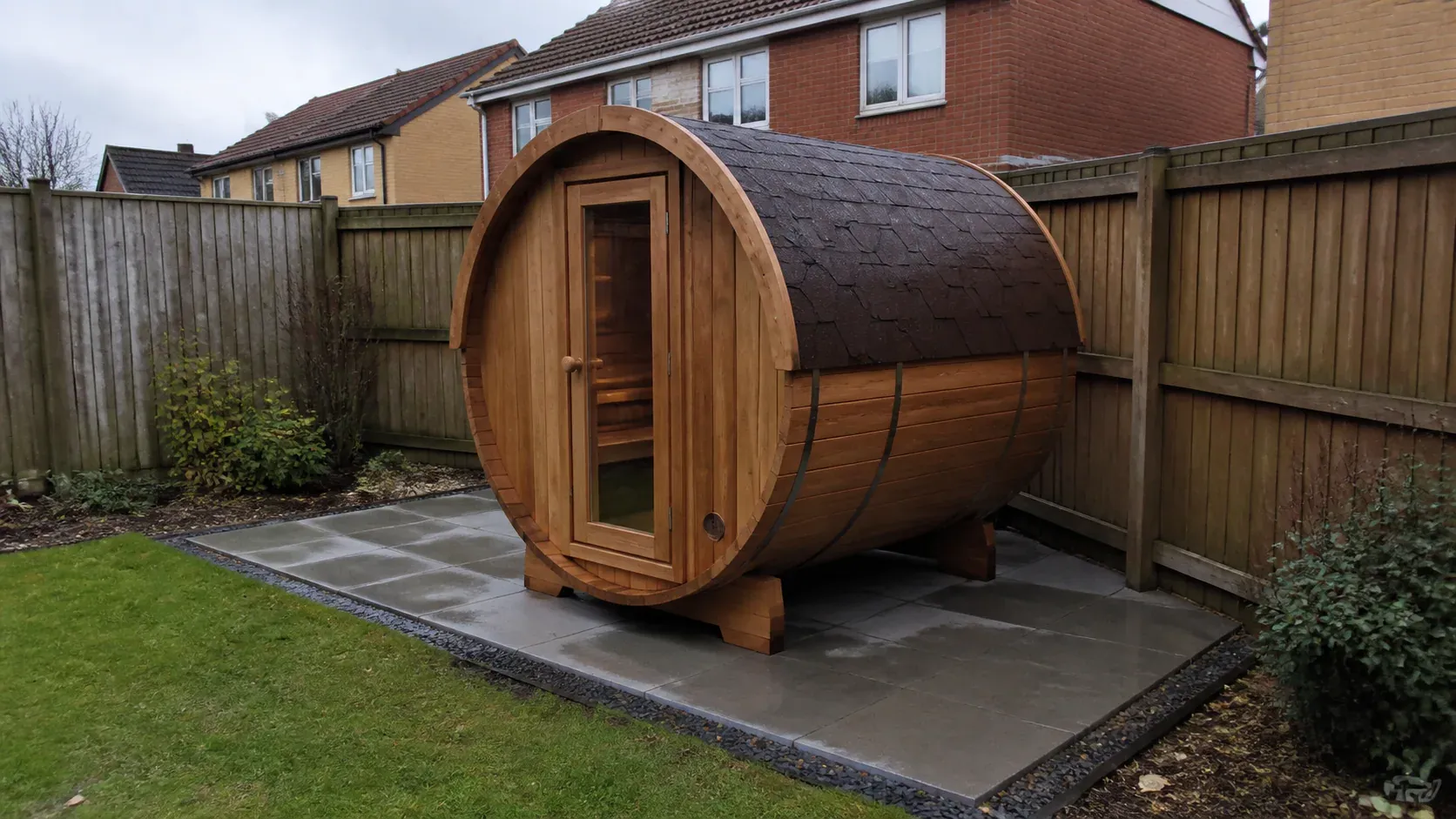 Timber outdoor sauna cabin on a neat garden base