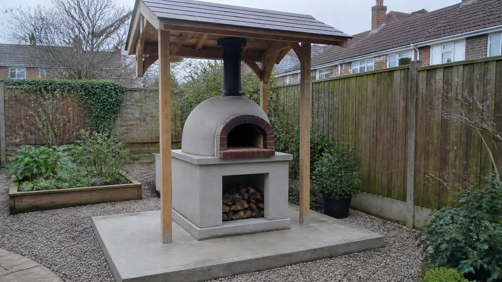 Masonry outdoor pizza oven on a robust garden base