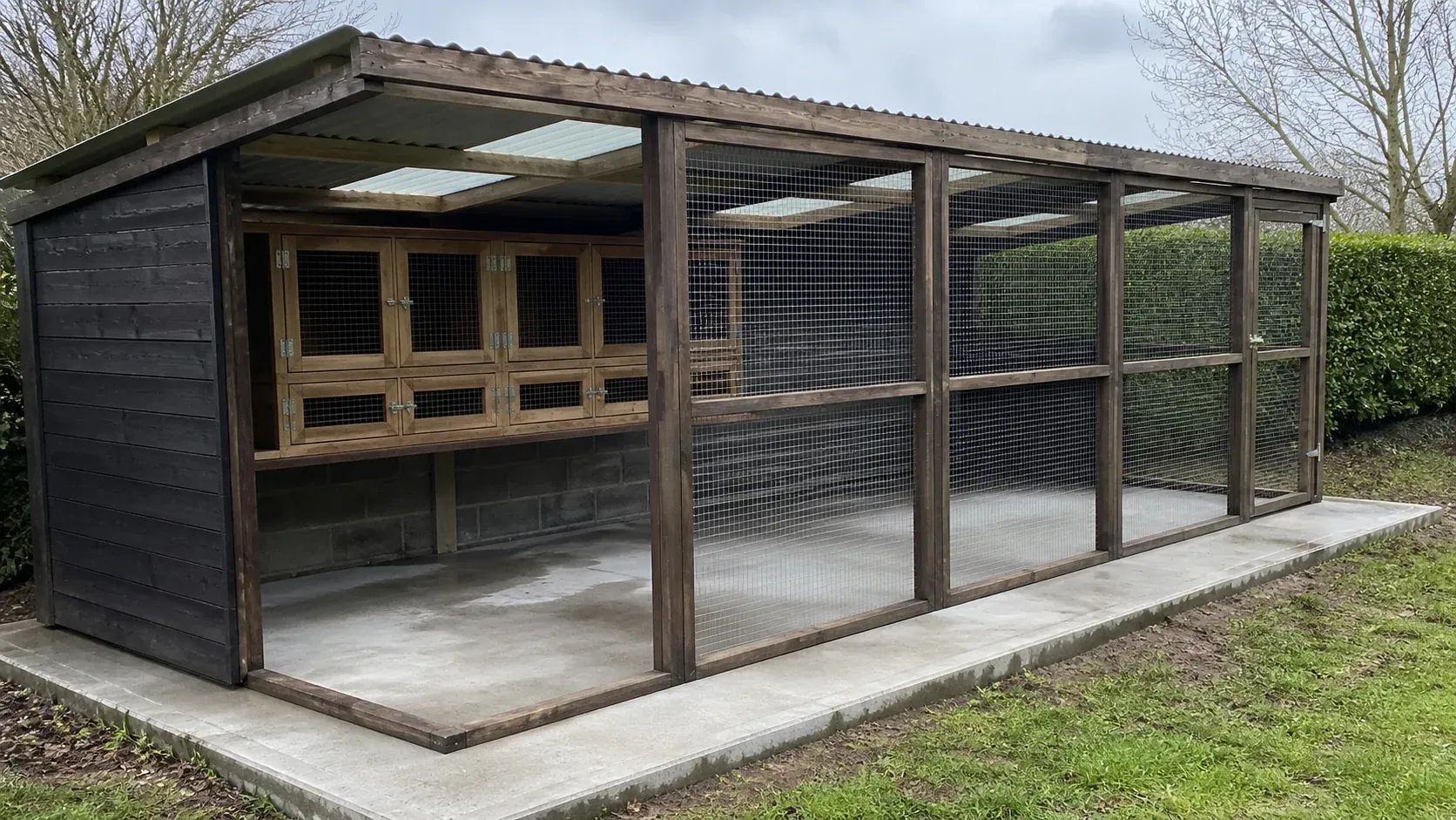 Spacious timber rabbit house and secure run on a dry level base