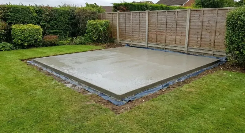 Prepared poured concrete base for a garden building